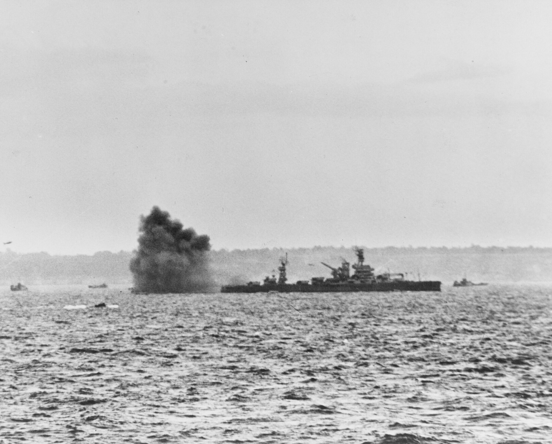 USS Arkansas engaging shore batteries off Omaha
